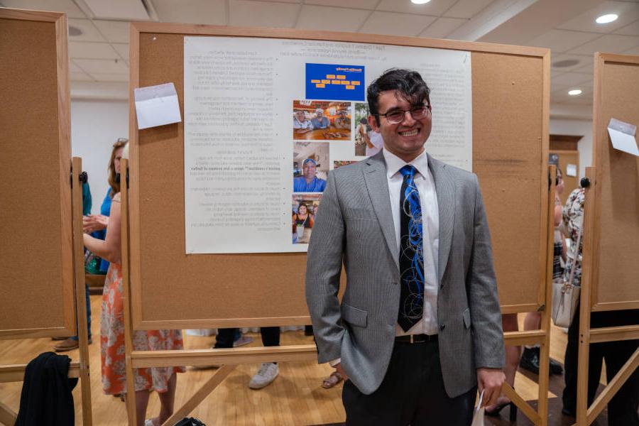 A student presents during the poster segment of the Undergraduate Research Conference.